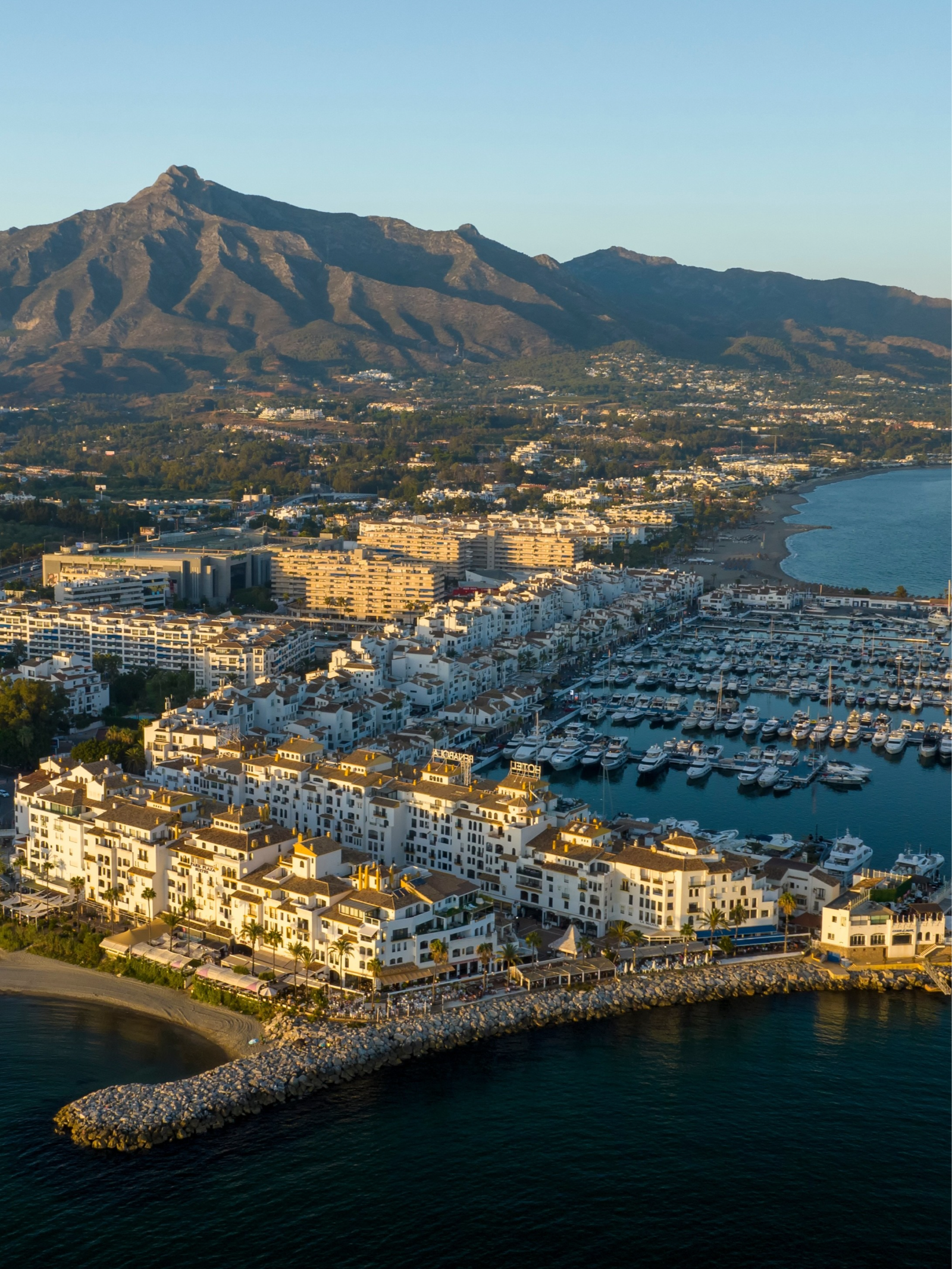 Puerto Banús marina and La Concha mountain in Marbella at sunset