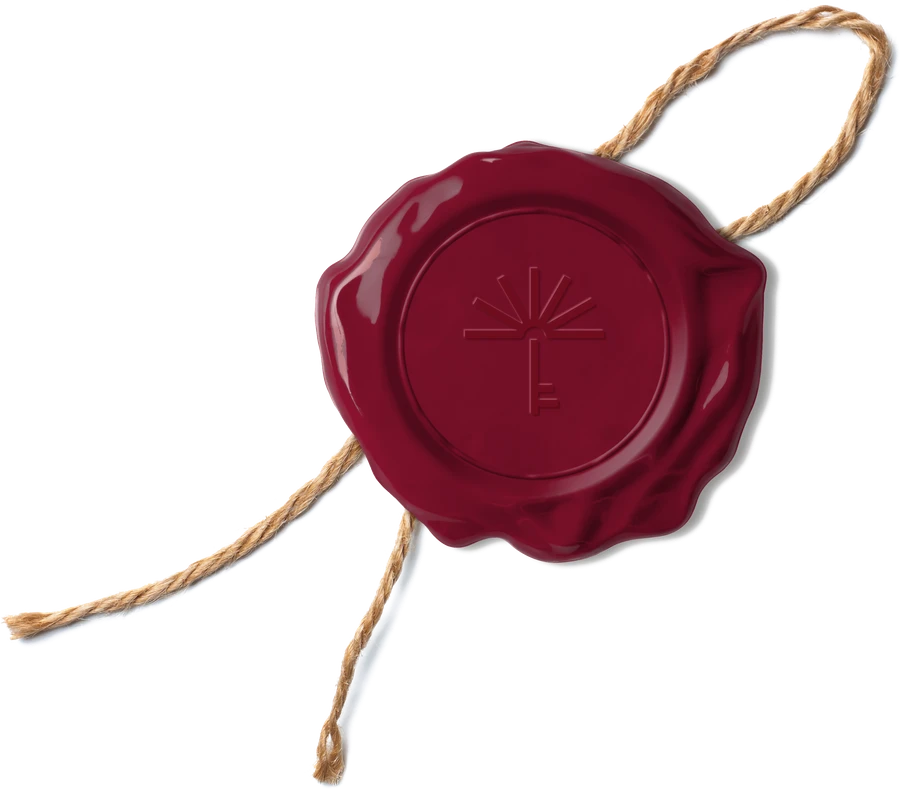InnovaLiving wax seal in burgundy, registered trademark in Spain